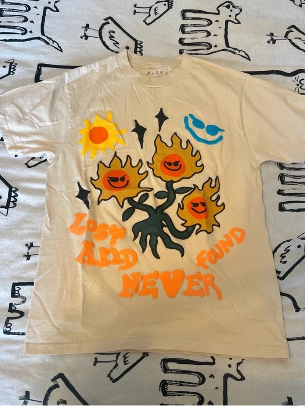 PacSun Kids Cream Graphic Tee with Neon Orange Sunflower Design